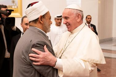 ABU DHABI, UNITED ARAB EMIRATES - February 3, 2019: Day one of the UAE Papal visit - His Holiness Pope Francis, Head of the Catholic Church (R) greets His Eminence Dr Ahmad Al Tayyeb, Grand Imam of the Al Azhar Al Sharif (L), at the Presidential Airport.  ( Ryan Carter / Ministry of Presidential Affairs ) ---