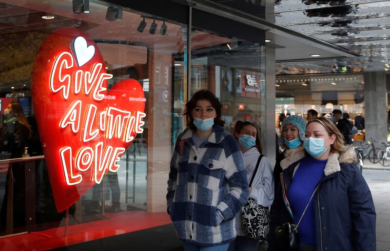 Christmas shoppers wearing face masks on Oxford street in London. Reuters