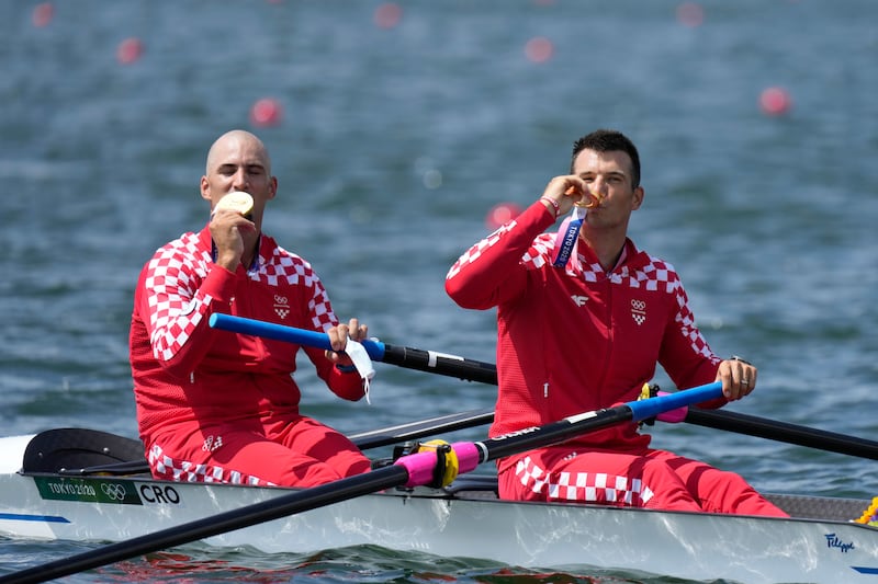 Martin Sinkovic and Valent Sinkovic of Croatia pose with their gold medals.