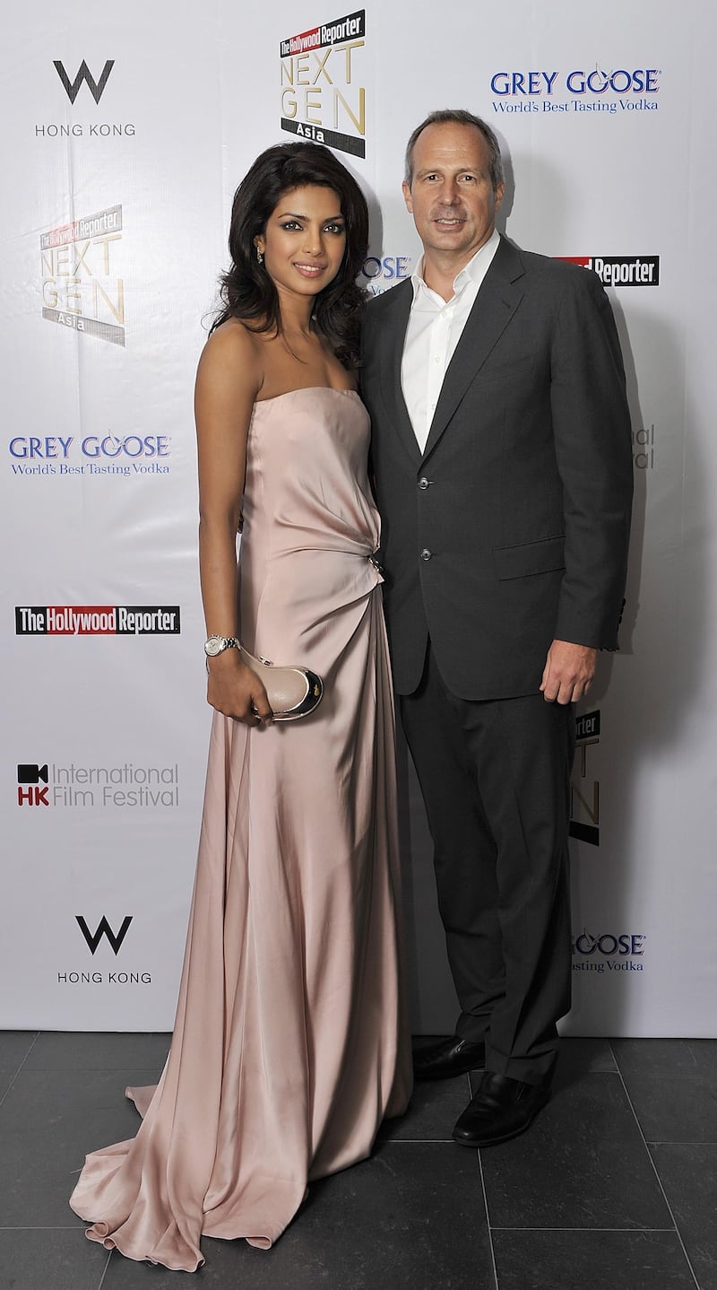 HONG KONG - MARCH 24:  Hollywood Reporter's Senior VP, Publishing Director Eric Mika (R) and Indian actress and former Miss World Priyanka Chopra attend The Hollywood Reporter Next Gen Asia Launch Cocktail Reception event at the W Hotel Kowloon on March 24, 2009 in Hong Kong, China.  The initiative has recognised over 500 individuals under 35 over the last 15 years, and is run in conjunction with the Hong Kong International Film Festival.  (Photo by Victor Fraile/Getty Images)