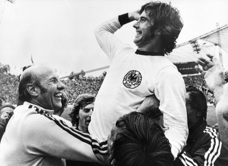 (FILE) - A file picture dated 07 July 1974 shows Germany's 2-1 winning goal scorer GerdÂ MuellerÂ (R)Â celebrating with German head coach Helmut Schoen (L)Â after winning the FIFAÂ 1974 World Cup final soccer match against the Netherlands in Munich, Germany (reissued 15 August 2021).  German soccer legend Gerd Mueller died on 15 August 2021 at the age of 75, his former club Bayern Munich released.   EPA / STAFF B / W ONLY   GERMANY OUT *** Local Caption *** 02240194