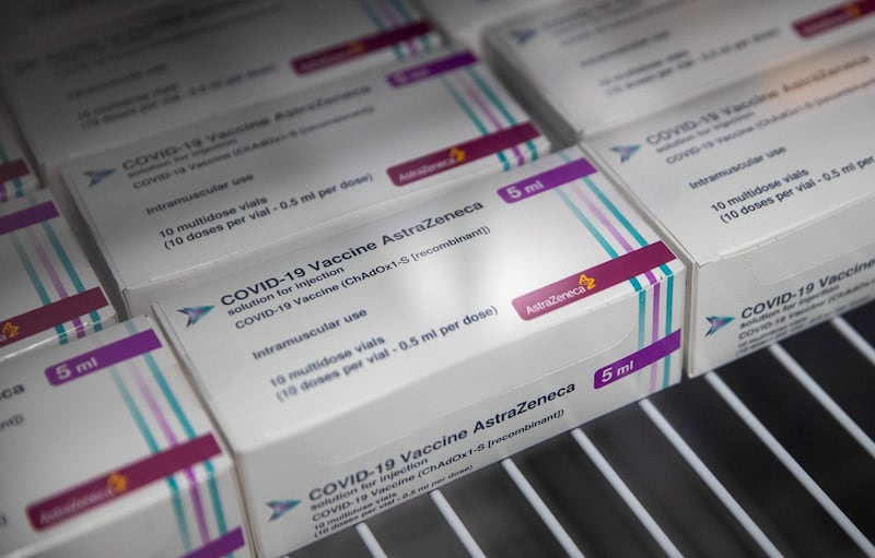 Boxes of vials of the Oxford/AstraZeneca Covid-19 vaccine are seen in a refridgerator at Ashton Gate Stadium in Bristol on January 9, 2021 one of seven mass vaccination centres which are set to open next week as Britain continues its vaccination programme against Covid-19.  Ashton Gate is one of the seven seven mass vaccination hubs opening around the country from next week. UK health officials and ministers have described the vaccination roll-out as a head-to-head race against the virus and the vaccination programme as the best hope of a return to normality. / AFP / POOL / Andrew Matthews
