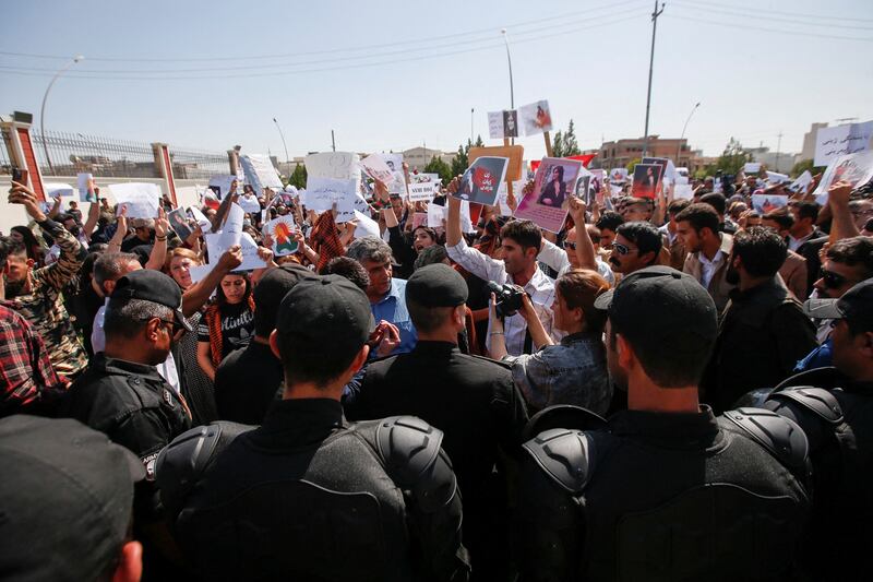 People protest in Erbil. Reuters