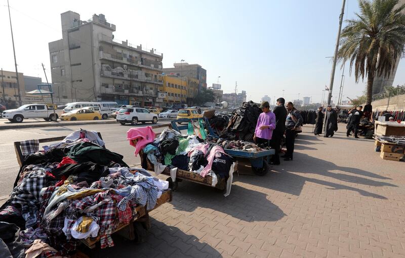 Iraqi street vendors display used clothes for sale at a street in central Baghdad, Iraq.  EPA
