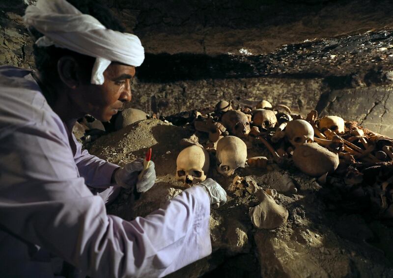 An antiquities worker is seen in the recently discovered tomb of Amenemhat, a goldsmith from the New Kingdom, at the Draa Abu-el Naga necropolis in Egypt. Mohamed Abd El Ghany / Reuters