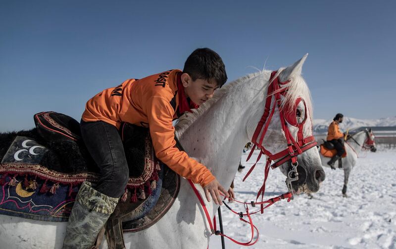 A player prepares for the start of a jereed game, in Erzurum, Turkey. The sport developed as a means of training cavalry.  EPA