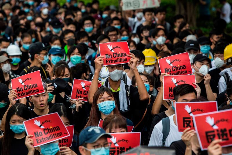 Protesters gather again to rally outside the Legislative Council government offices against a controversial extradition bill in Hong Kong on June 17, 2019. Beijing reiterated its backing of Hong Kong's embattled leader Carrie Lam on June 17 after a massive demonstration demanding her resignation over a controversial extradition bill. / AFP / ISAAC LAWRENCE

