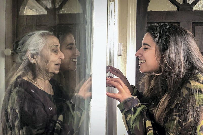 This photograph, taken on 20 June 2020, captures love and connection during lockdown. It shows my sister-in-law with her grandmother (Dadi in Punjabi) meeting after months of being apart. In this moment I felt the depth of love they feel for each other, captured by both the joy and longing in their eyes. Separated by a window but connected by love by SIMRAN JANJUA