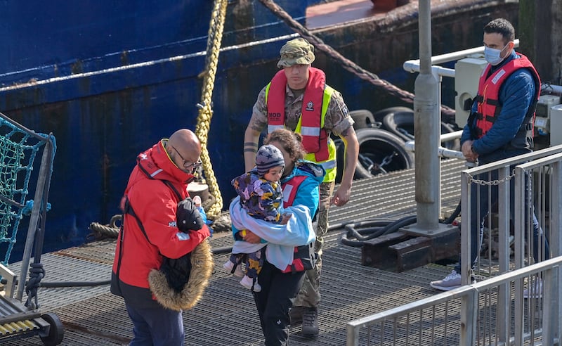 Border Force officers escort 40 migrants into  Dover on May 6, 2022. EPA