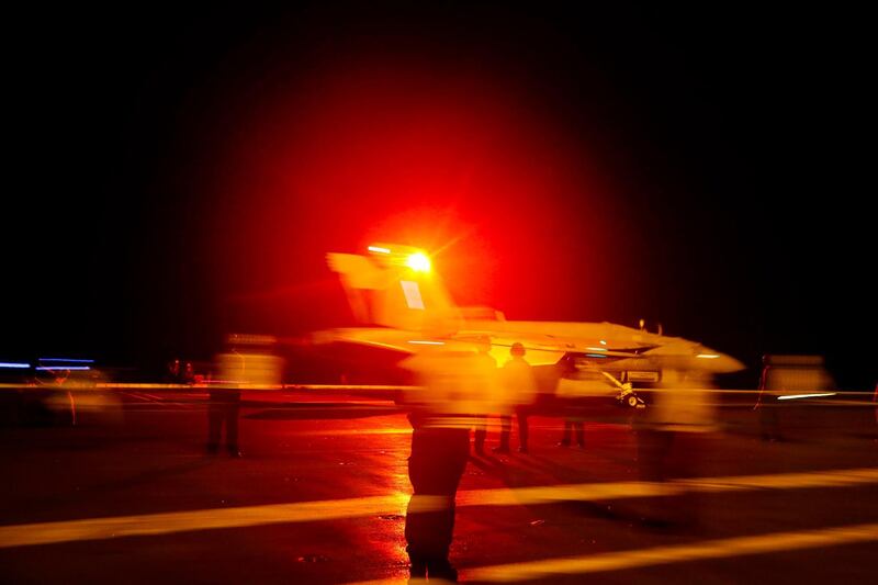 A handout photo made available by the US Navy showing a US F/A-18E Super Hornet from the 'Sidewinders' of Strike Fighter Squadron (VFA) 86 launching from the flight deck of the Nimitz-class aircraft carrier USS Abraham Lincoln (CVN 72) in the Red Sea.  EPA/US NAVY