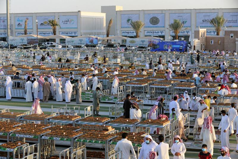 Saudi farmers display dates to customers during Unaizah Season for Dates, at Unaizah city in Al-Qassim province, Saudi Arabia. Reuters