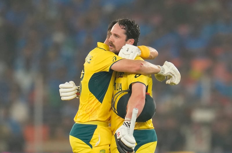 Australia's Marnus Labuschagne, left, hugs Travis Head as latter celebrates his century. AP
