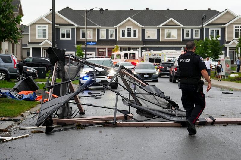 Debris in the street after a tornado hit the Ottawa suburb of Barrhaven. AP