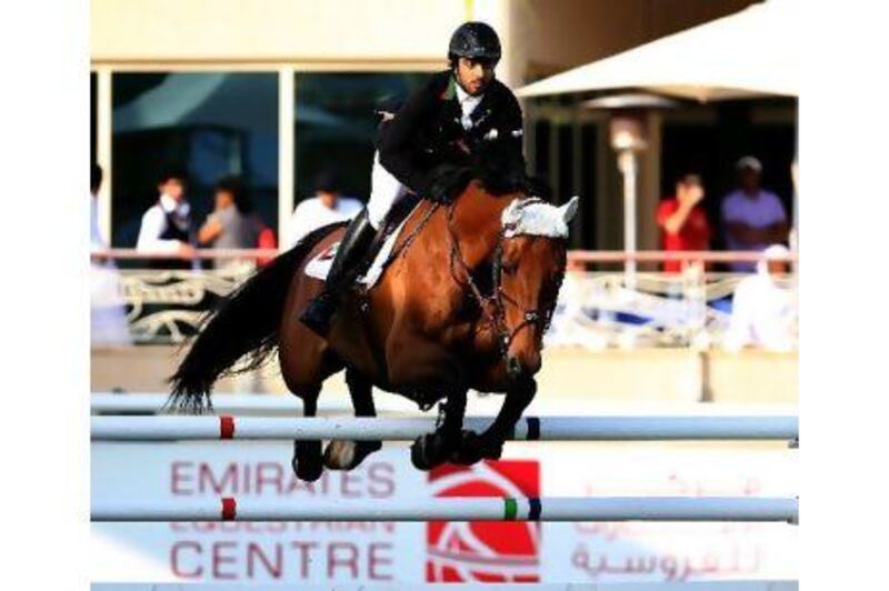 Sheikh Ali Al Qassimi riding Tisanto during the Class 2 at the Dubai Show Jumping Champioships. Satish Kumar / The National