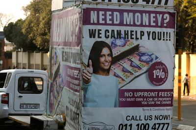 A loans company advertises its services in the Rosebank suburb of Johannesburg, Tuesday, Sept. 4, 2018.  The South African economy has fallen into recession, compounding concerns about its weakening currency, plans for land reform and fallout from state corruption under former president Jacob Zuma. (AP Photo/Denis Farrell)