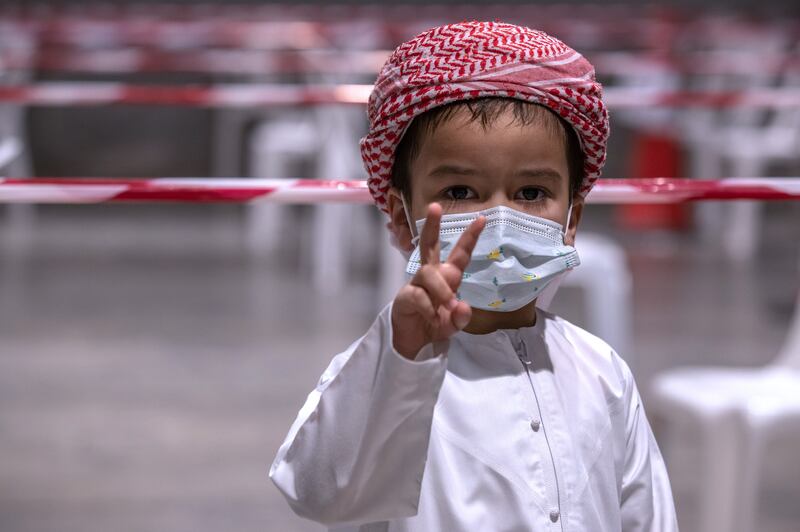 Khalifa Al Nahdi, 4, queues for a test. 
