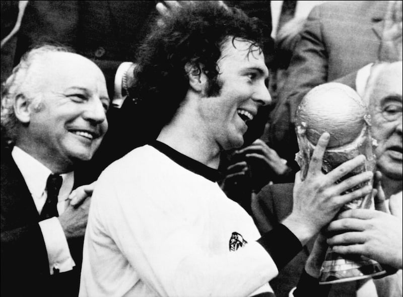 Germany captain Franz Beckenbauer receives the World Cup after a 2-1 victory over the Netherlands on July 7, 1974 in Munich. AFP
