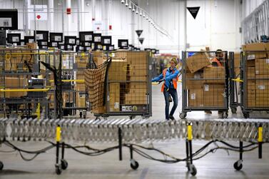 The new employees will help Amazon to meet the surge in demand from people relying on the company's services. AP