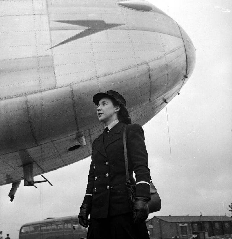 A cabin crew member stands under the nose of a BOAC (British Overseas Airways Corporation, which would eventually become British Airways) jet in 1946. Getty Images