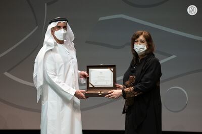 Sheikh Saif bin Zayed Al Nayhan, Deputy Prime Minister of the UAE, gives the Sheikh Zayed Book Award to Maisoon Saqer at Louvre Abu Dhabi. Photo: Arabic Language Centre