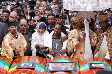 Family members of Captain Yared Getecho mourn in front of his coffin during a memorial service for the Ethiopian passangers and crew who perished in the Ethiopian Airways ET302 crash. The airline said pilots were trained on the new Max jet. Getty