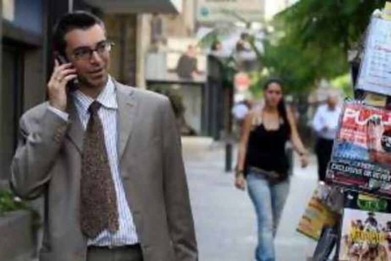 TO GO WITH AFP STORY BY RANA MOUSSAOUI 
A Lebanese man speaks on his mobile in Beirut, 01 November 2007. Lebanon, known to have among the costliest phone bills in the world, is due to soon offer bids for the privatisation of its mobile network that is expected to take place early next year. The Telecommunications Regulatory Authority (TRA) is due to hold a press conference 02 November to set the date of the bids for the GSM network, with a maximum deadline for applications in January 2008. AFP PHOTO/JOSEPH BARRAK