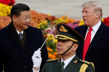 US President Donald Trump with China's President Xi Jinping in Beijing during pleasanter times in 2017. Reuters