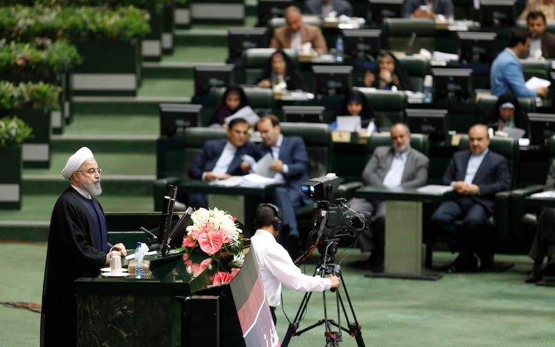 Iranian President Hassan Rouhani (L) delivers a speach to the parliament in Tehran on August 20, 2017, as Iran's parliament prepares to vote on the President's cabinet.
Iran's President said the top foreign policy priority for his new government was to protect the nuclear deal from being torn up by the United States. / AFP PHOTO / STR