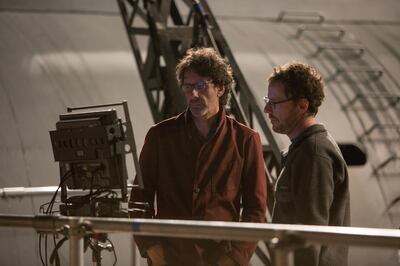 A handout photo of (L to R) filmmakers Joel Coen and Ethan Coen on the set of "Hail​, Caesar!," an all-star comedy set during the latter years of Hollywood's Golden Age. The film written, directed and produced by the Coen brothers follows a single day in the life of a studio fixer who is presented with plenty of problems to fix. (Alison Rosa / Universal Pictures)