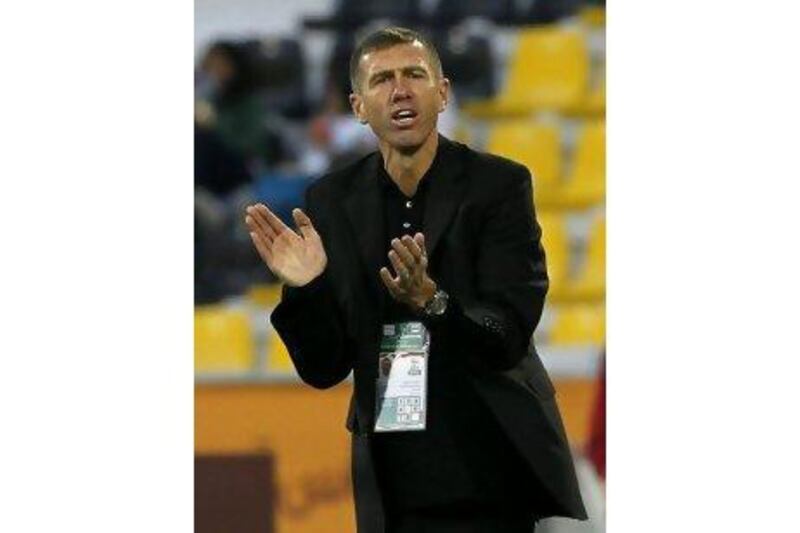 Srecko Katanec, the UAE coach, shouts instructions to his team last night. Hassan Ammar / AP Photo
