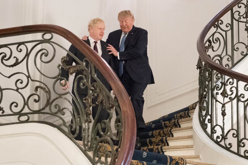 Former US president Donald Trump and Mr Johnson arrive for a bilateral meeting during the G7 summit in August 2019, in Biarritz, France. Getty Images
