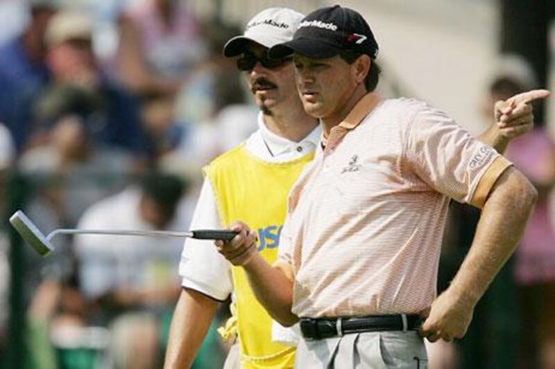 Retief Goosen, the South African, confers with his caddie Colin Byrne during the 2005 US Open. Byrne said the art of caddying is ‘understanding whom your dealing with’ and ‘what would motivate them.’