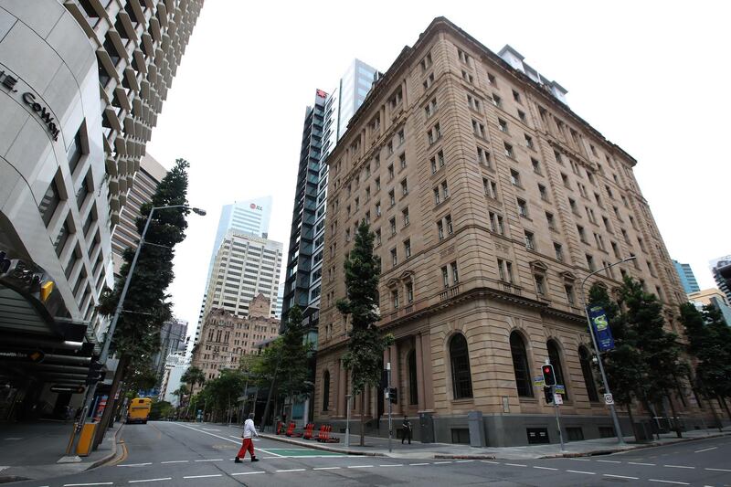 BRISBANE, AUSTRALIA - JANUARY 09: A local resident walks in the CBD, on January 09, 2021 in Brisbane, Australia. According to reports, Queensland has recorded no new cases of coronavirus overnight as Brisbane residents remain under lockdown. Greater Brisbane is under a three-day lockdown until 6 pm on Monday, January 12 after a cleaner working at one of the city's quarantine hotels tested positive for a new variant of the Covid-19 strain that originated in the UK. (Photo by Jono Searle/Getty Images)