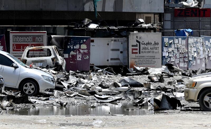 Sharjah, United Arab Emirates - Reporter: N/A: Fire. General View of Abbco Tower after a massive fire last night. Wednesday, May 6th, 2020. Sharjah. Chris Whiteoak / The National