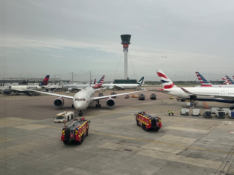 The Virgin Atlantic and British Airways aircraft surrounded by emergency vehicles at Heathrow in an image posted to social media site X. PA