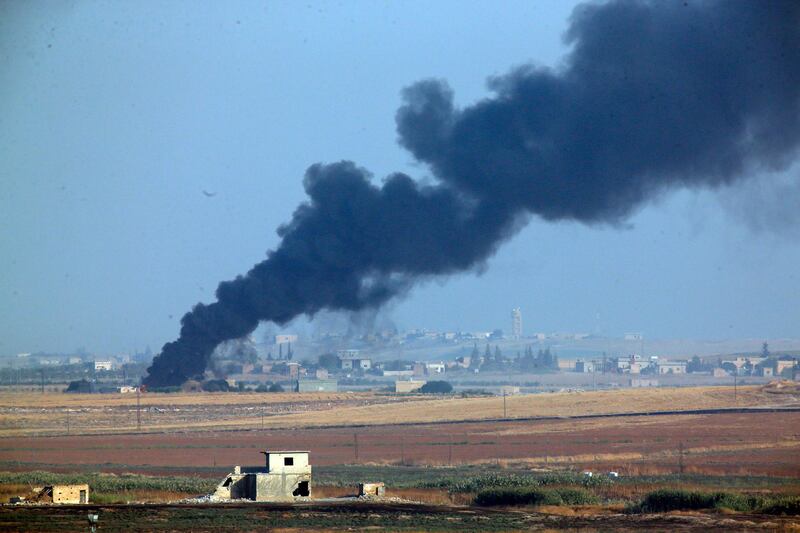 In this photo taken from the Turkish side of the border between Turkey and Syria, in Akcakale, Sanliurfa province, southeastern Turkey, smoke billows from a fire inside Syria during bombardment by Turkish forces. AP Photo