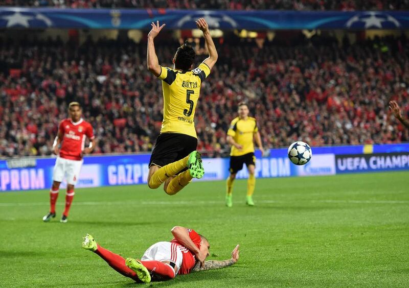 Borussia Dortmund defender Marc Bartra (top) is tackled by Benfica midfielder Ljubomir Fejsa during their Uefa Champions League first-leg tie at the Luz stadium in Lisbon on February 14, 2017. Benfica won 1-0. Francisco Leong / AFP
