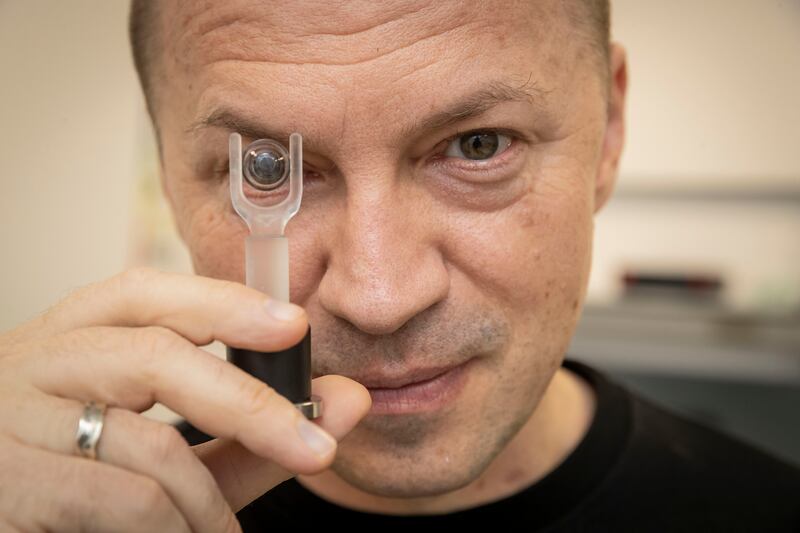 Valentyn Volkov, co-founder and scientific partner at Dubai-based start-up Xpanceo, holds a prototype smart contact lens. All photos: Antonie Robertson / The National