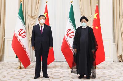 Chinese President Xi Jinping, left, and his Iranian counterpart Ebrahim Raisi pose for picture at the Shanghai Co-operation Organisation summit in Samarkand, Uzbekistan. Getty