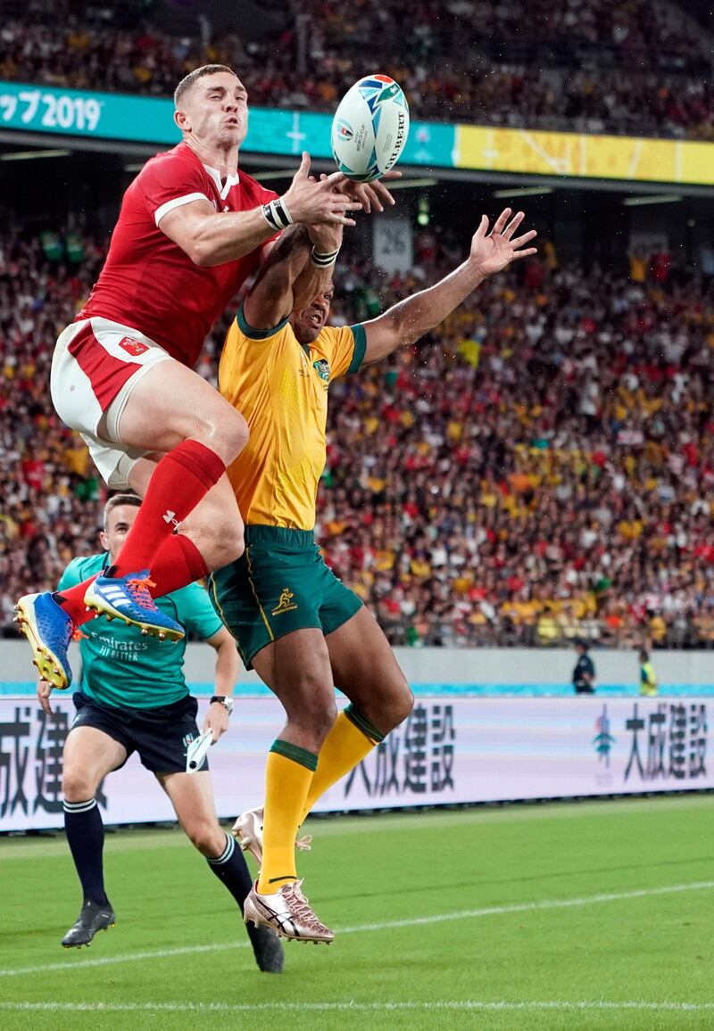 George North, left, of Wales and Australia's Kurtley Beale compete for a high ball at the Tokyo Stadium.  EPA