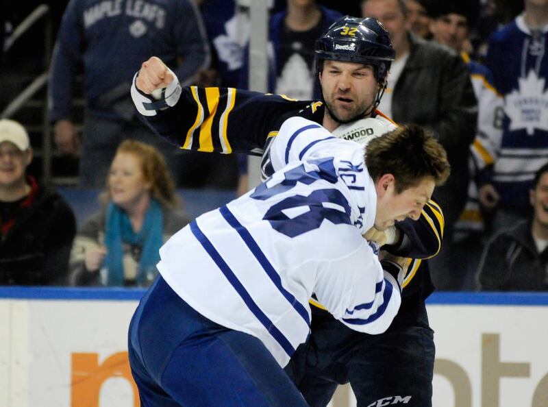 The more the Buffalo Sabres lose, the more often left wing John Scott , back, takes to throwing around his body and his fists, such as here against Toronto Maple Leafs' Frazer McLaren. Also adding up the penalty minutes for the Sabres is Patrick Kaleta. Doug Benz / Reuters

