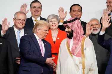 U.S. President Donald Trump shakes hands with Saudi Arabia's Crown Prince Mohammed bin Salman during family photo session with other leaders and attendees at the G20 leaders summit in Osaka, Japan, June 28, 2019. REUTERS/Kevin Lamarque