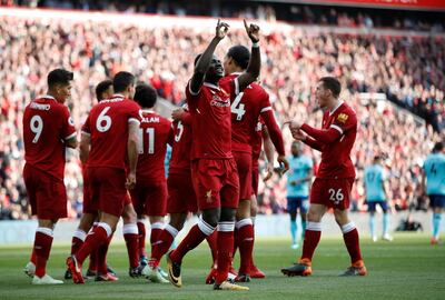 Soccer Football - Premier League - Liverpool vs AFC Bournemouth - Anfield, Liverpool, Britain - April 14, 2018   Liverpool's Sadio Mane celebrates scoring their first goal with team mates      Action Images via Reuters/Carl Recine    EDITORIAL USE ONLY. No use with unauthorized audio, video, data, fixture lists, club/league logos or "live" services. Online in-match use limited to 75 images, no video emulation. No use in betting, games or single club/league/player publications.  Please contact your account representative for further details.