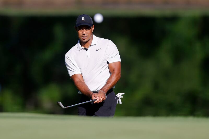 Tiger Woods hits a chip shot on the 11th hole during a practice round for the PGA Championship. AP