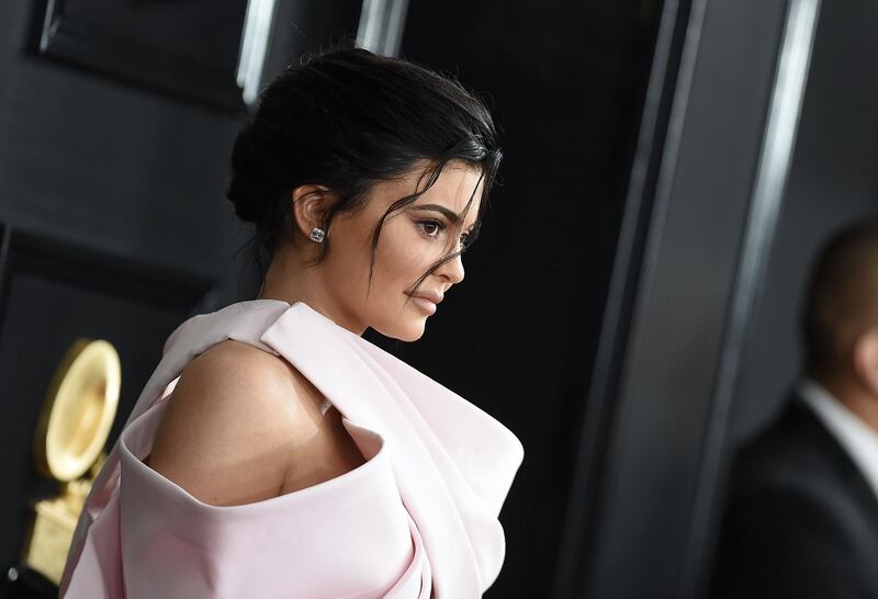 (FILES) In this file photo taken on February 10, 2019 TV personality Kylie Jenner arrives for the 61st Annual Grammy Awards in Los Angeles.  Beauty products giant Coty announced on November 18, 2019 a deal to take a majority stake in Kylie Jenner's cosmetics and skincare company, marrying Jenner's celebrity prominence with Coty's distribution and commercial prowess. Under the transaction, Coty, whose brands include Hugo Boss and Burberry fragrances,  will pay $500 million for a 51 percent stake in Jenner's company. Jenner is the youngest daughter of Kris Jenner and Caitlyn Jenner, formerly known as Bruce Jenner. / AFP / VALERIE MACON

