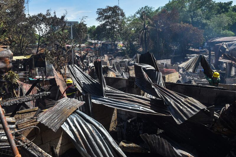 Firefighters work at the scene.