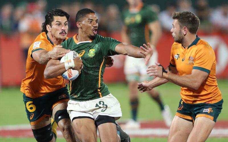 Shilton Van Wyk, centre, of South Africa in action during the Emirates Dubai 7s Rugby tournament final against Australia on 4 December, 2021.   EPA