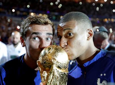France's Kylian Mbappe and Antoine Griezmann celebrate after winning the 2018 World Cup. Reuters