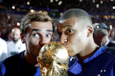 FILE PHOTO: Soccer Football - UEFA Nations League - League A - Group 1 - France v Netherlands - Stade de France, Saint-Denis, France - September 9, 2018  France's Kylian Mbappe and Antoine Griezmann celebrate with the World Cup trophy during a ceremony after the match  REUTERS / Charles Platiau / File Photo