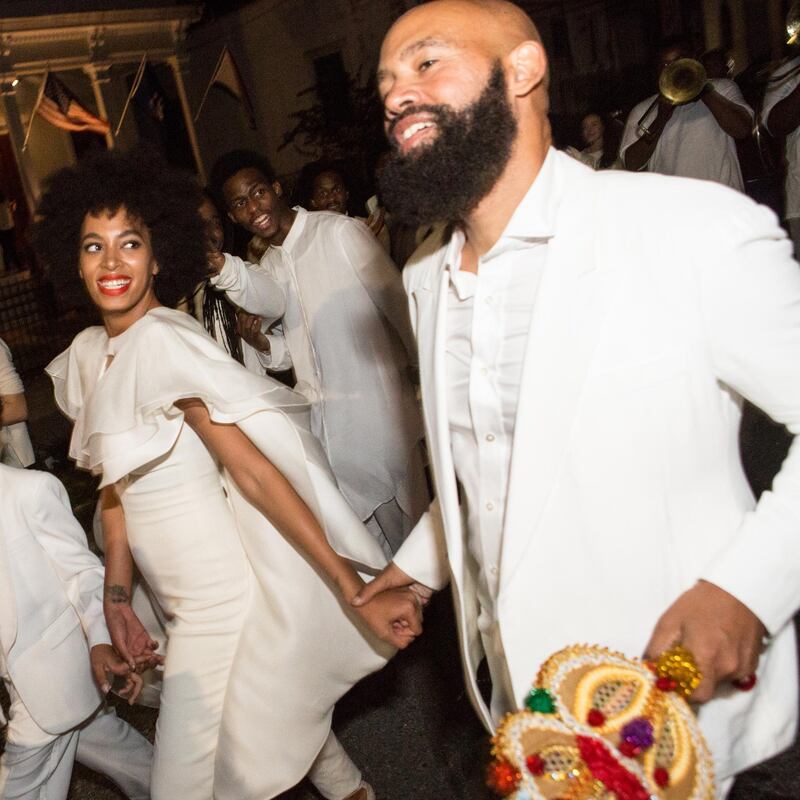 NEW ORLEANS, LA - NOVEMBER 16:  Musician Solange Knowles (L) and her new husband, music video director Alan Ferguson, attend the secondline with family and friends following their wedding on November 16, 2014 in New Orleans, Louisiana.  (Photo by Josh Brasted/WireImage/Getty Images)